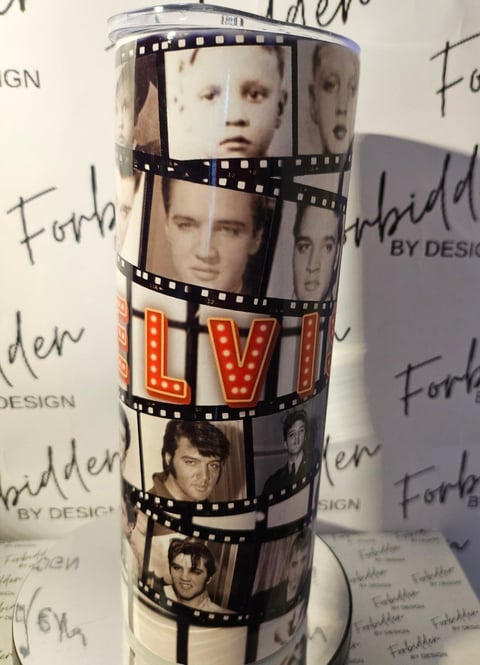 Cylindrical tumbler with film strip design featuring celebrity portraits and red ELVIS lettering on patterned background