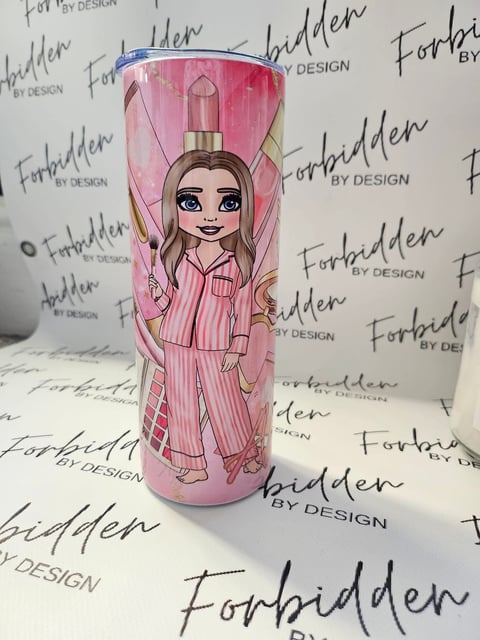 Pink tumbler with cartoon girl illustration and perfume bottle design on Forbidden by Design branded background